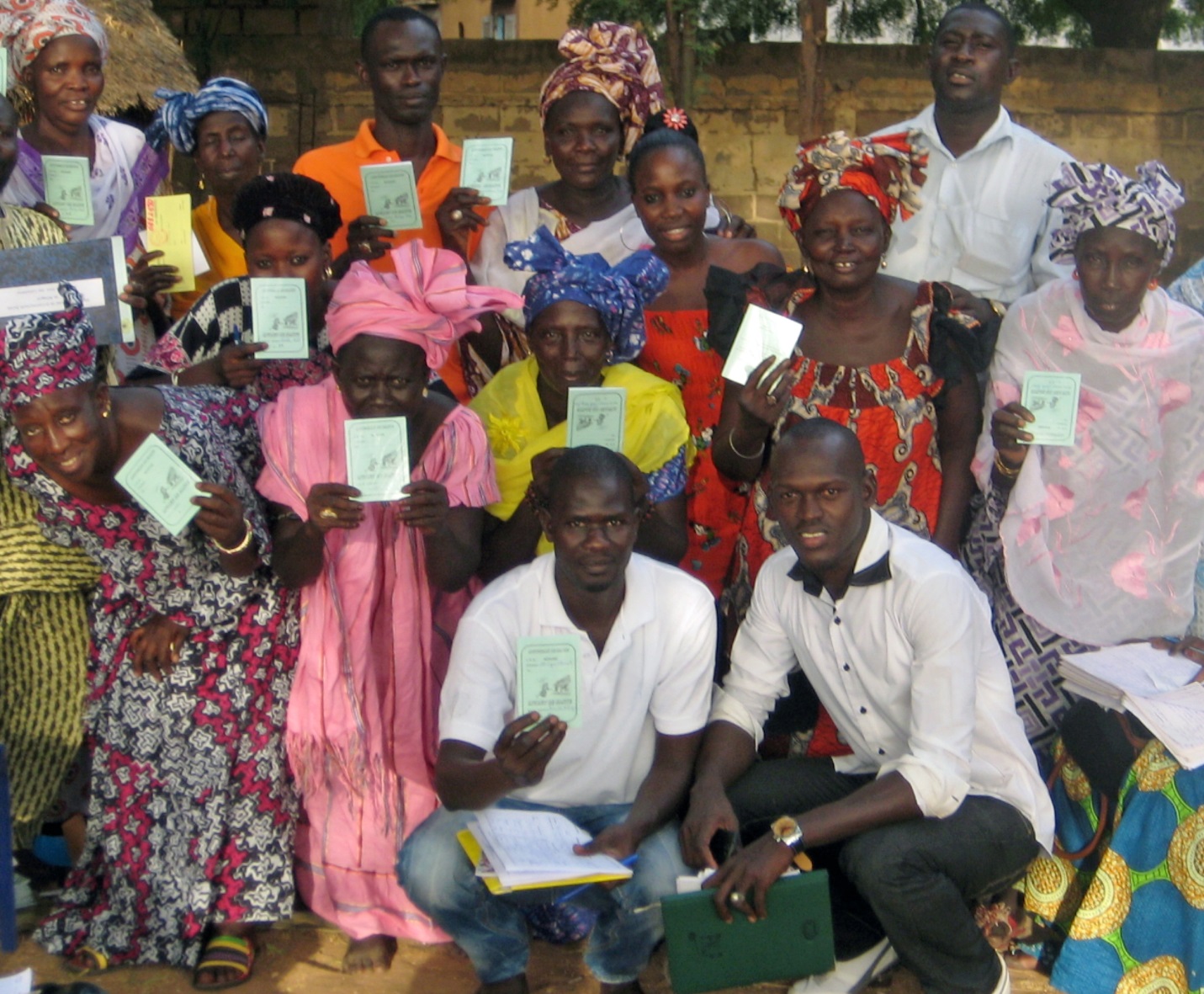 Community based health Insurance (CBHI) members of the Ndiagne commune, Louga region, Senegal, show their member cards.