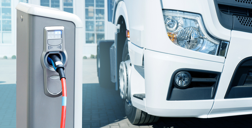 electric vehicle next to charging station