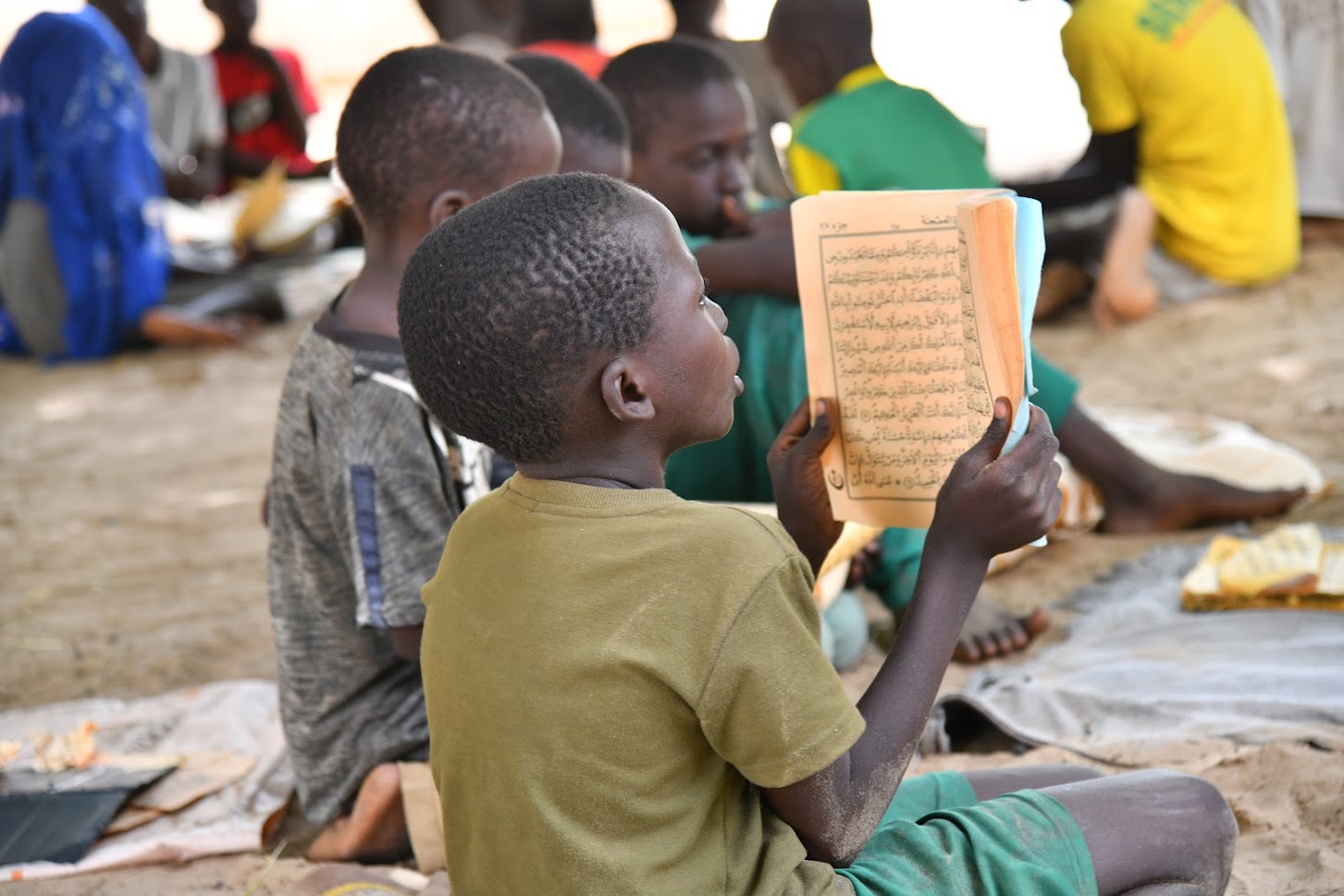 A child learning the Koran in a daara in Méouane health post in Tivaouane. Photo Credit: Louis Dasylva, photographer