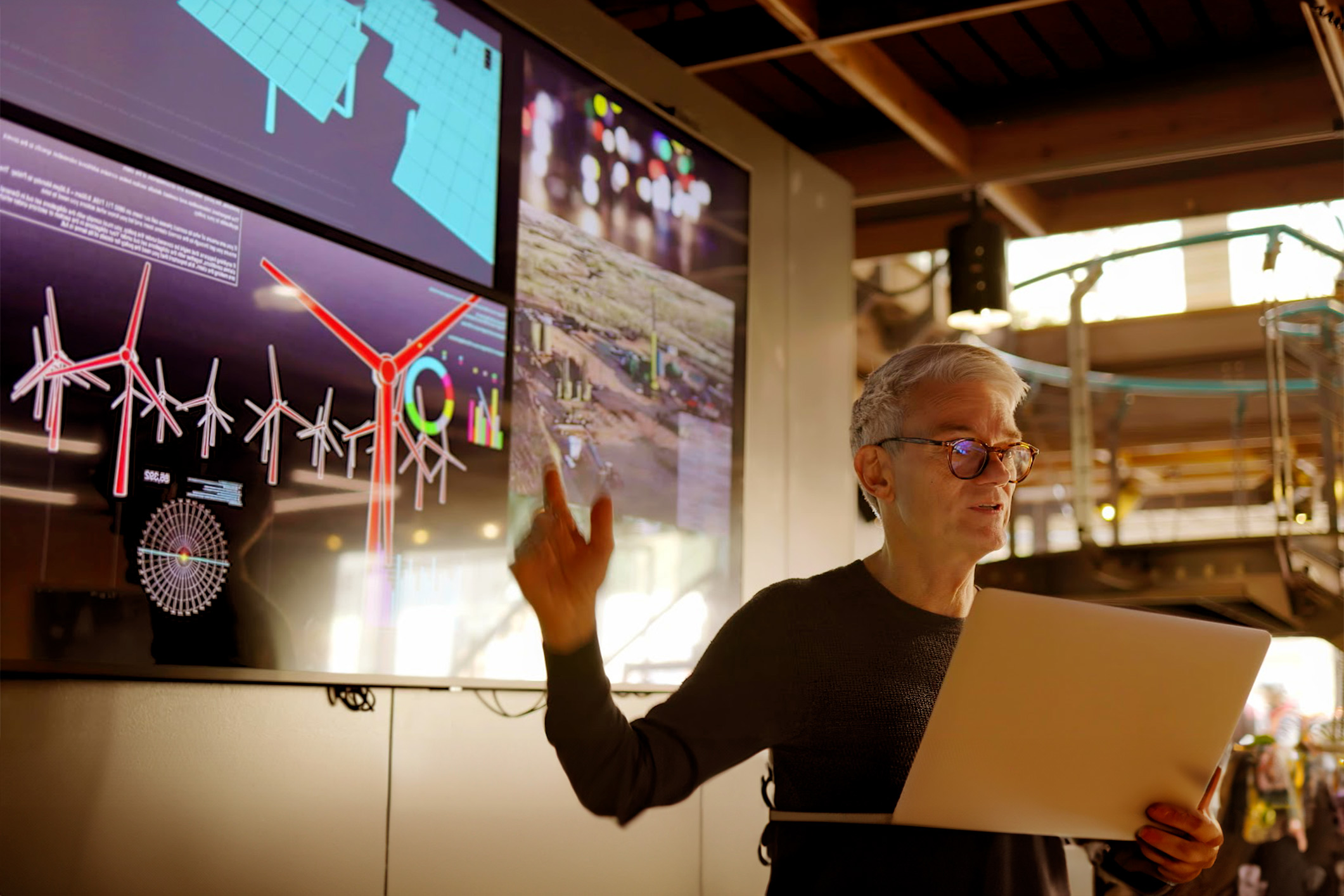 Man giving presentation in front of a digital presentation