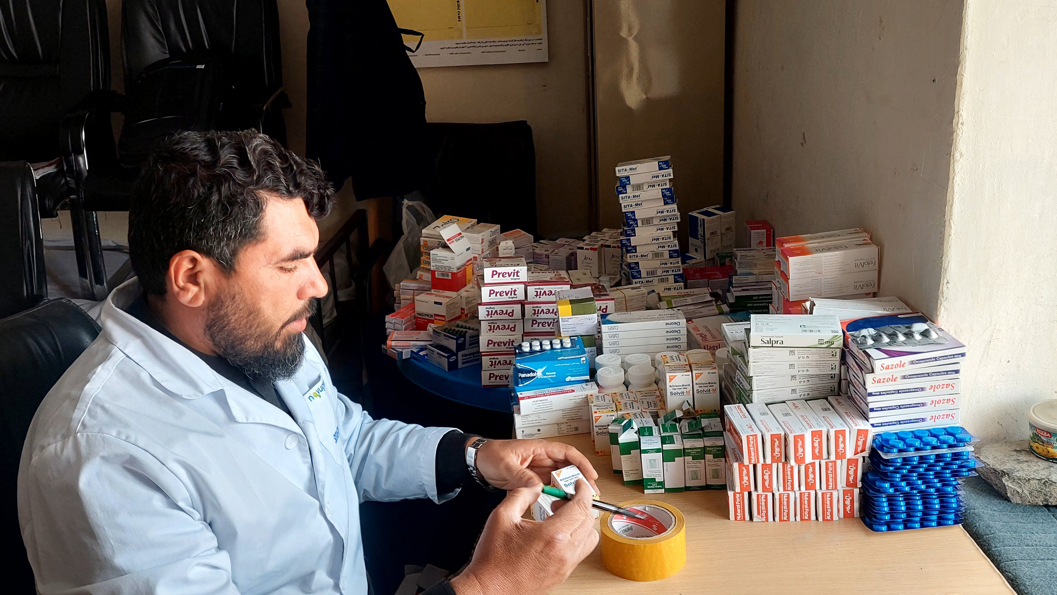 doctor preparing medicine in afghanistan hospital