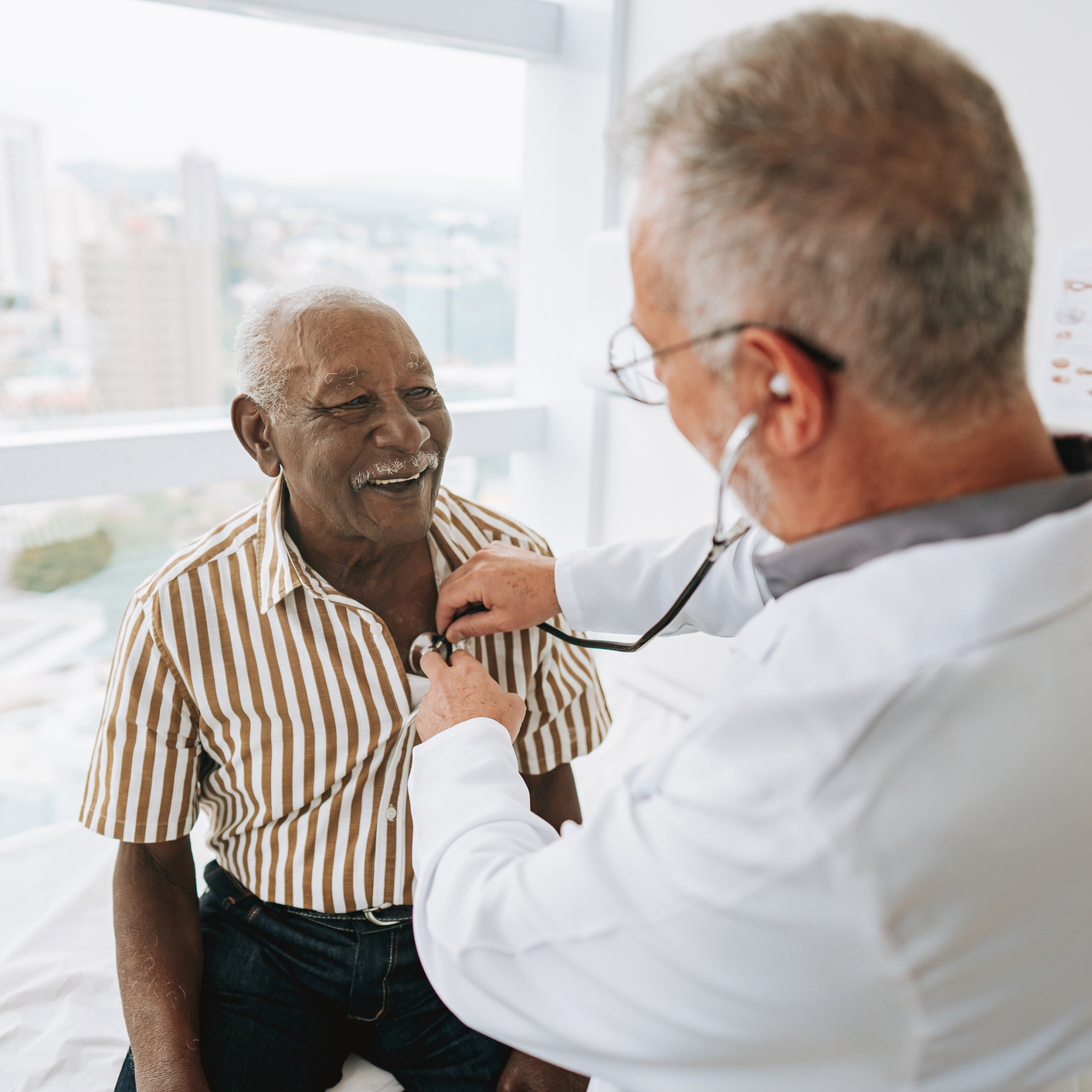 Doctor listening to patient with a stethoscope