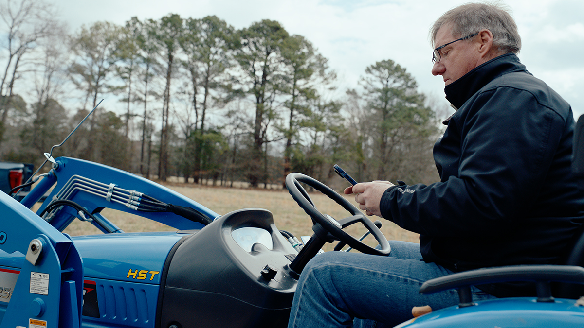 chris long on a tractor