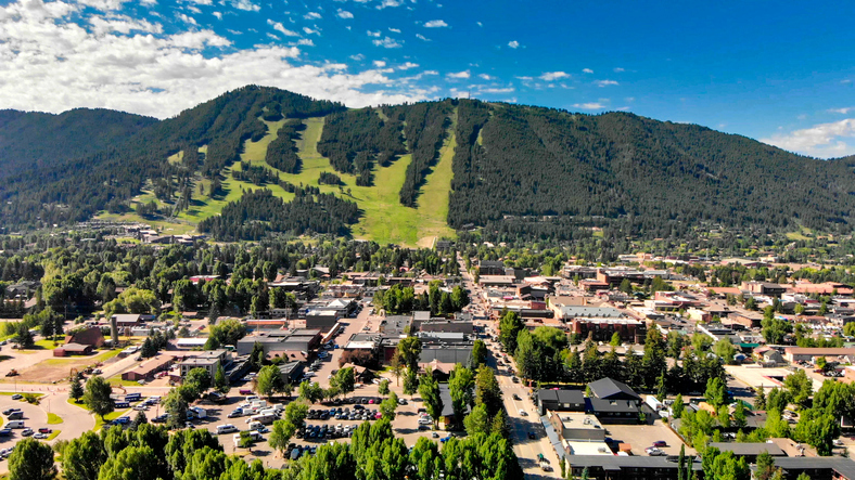 Panoramic aerial view of Jackson Hole homes and beautiful mountains on a summer morning, Wyoming