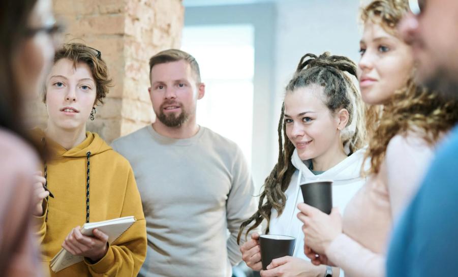 group of twenty-somethings talking in a group