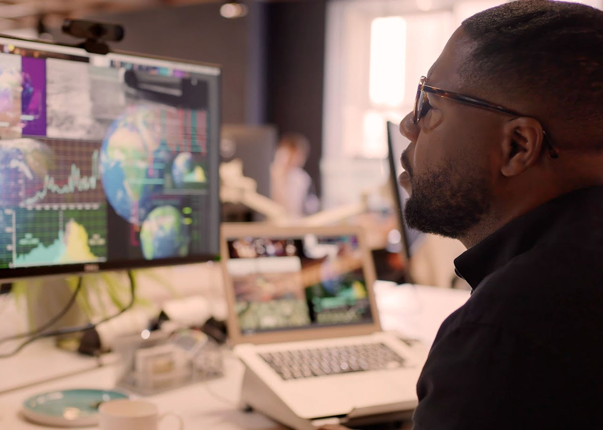 man sitting at his computer