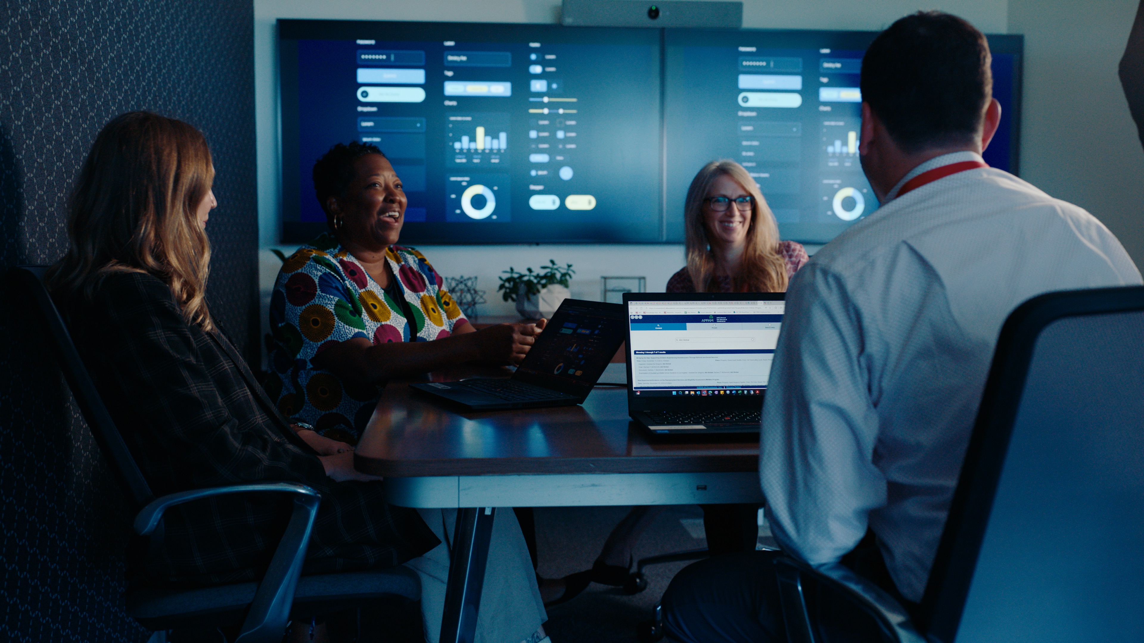 employees talking around a table