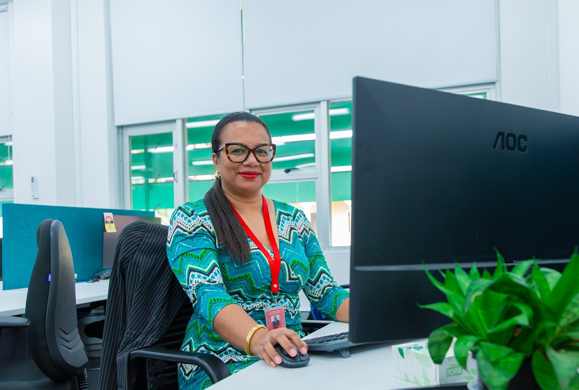 abt Fiji staff sitting at her computer
