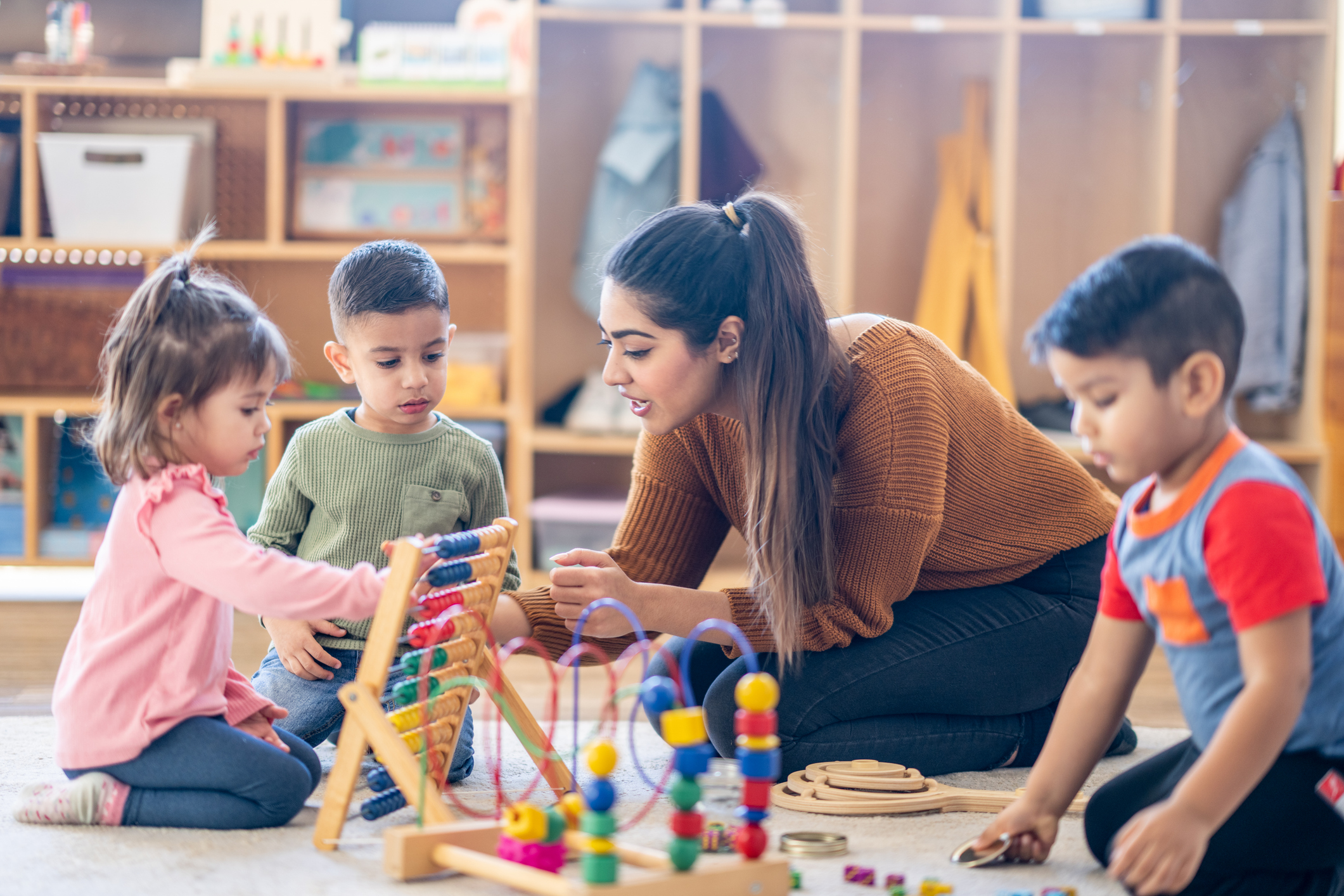 teacher in classroom teaching young children