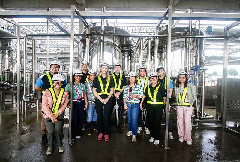 women tour a plant during an Investing in Women event