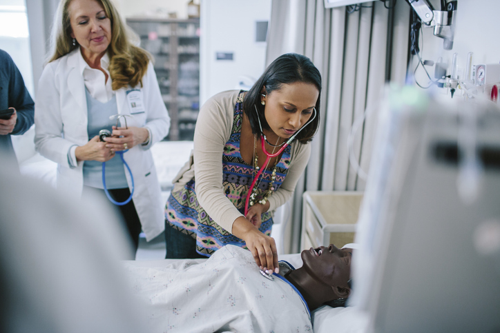 doctor listening to a patient's heart