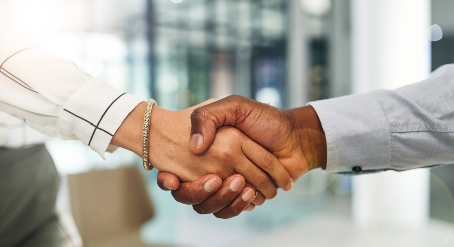 close up of two people shaking hands