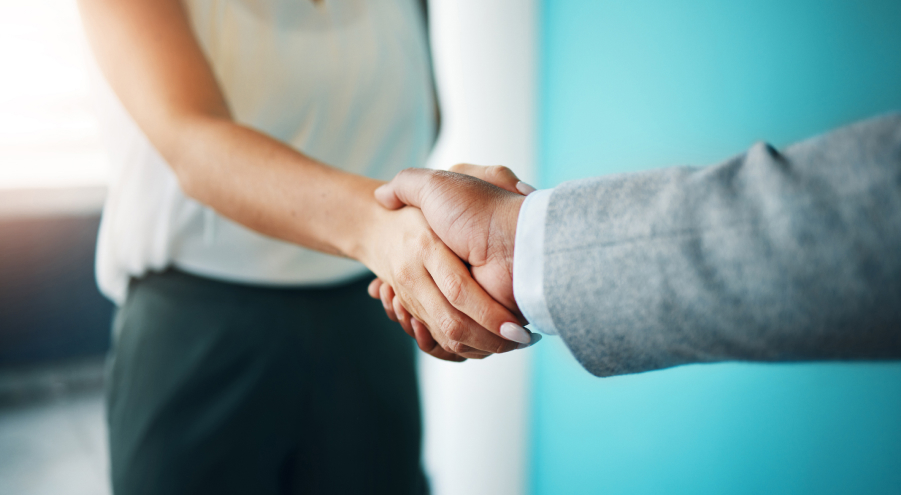 close up of two people shaking hands