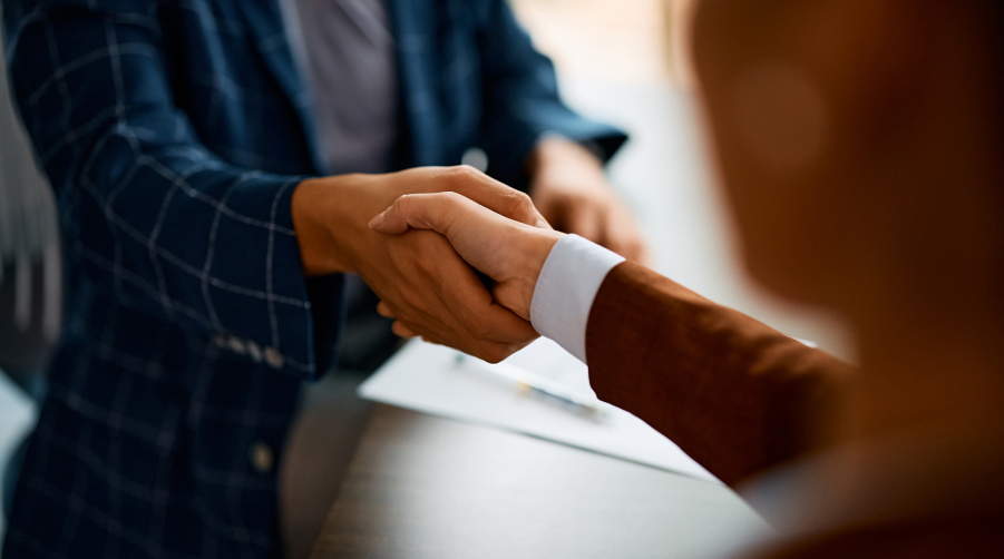 close up of two people shaking hands