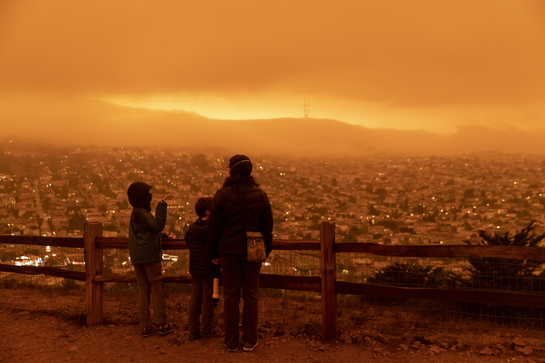 San Francisco California, USA - September 9, 2020: The sky across California darkened and stayed orange during day as smoke from many wildfires across the state created a massive smoke cloud changing the sunlight to a perpetual orange glow.