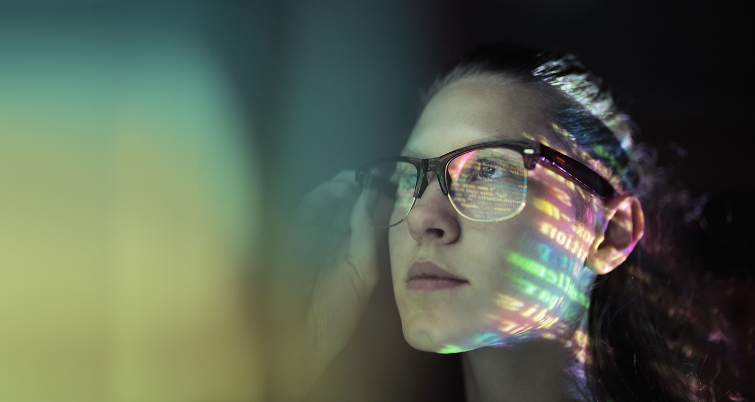 artistic image of computer graphics glowing across a woman's face