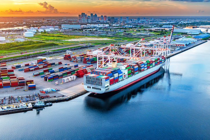 A fully loaded container ship in moored at the commercial docks of the Port of Tampa Bay located near downtown Tampa Florida 