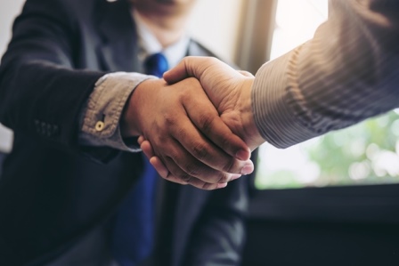 Two people shaking hands