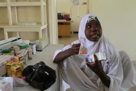 Adama Usman, 23, a farmer with four children, shows off the more affordable medicine she bought during a visit to the Hadejia General Hospital in Jigawa state, Nigeria