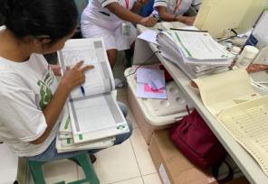 woman looking at data in a spreadsheet