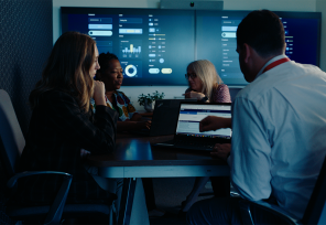 colleagues working in hi-tech conference room