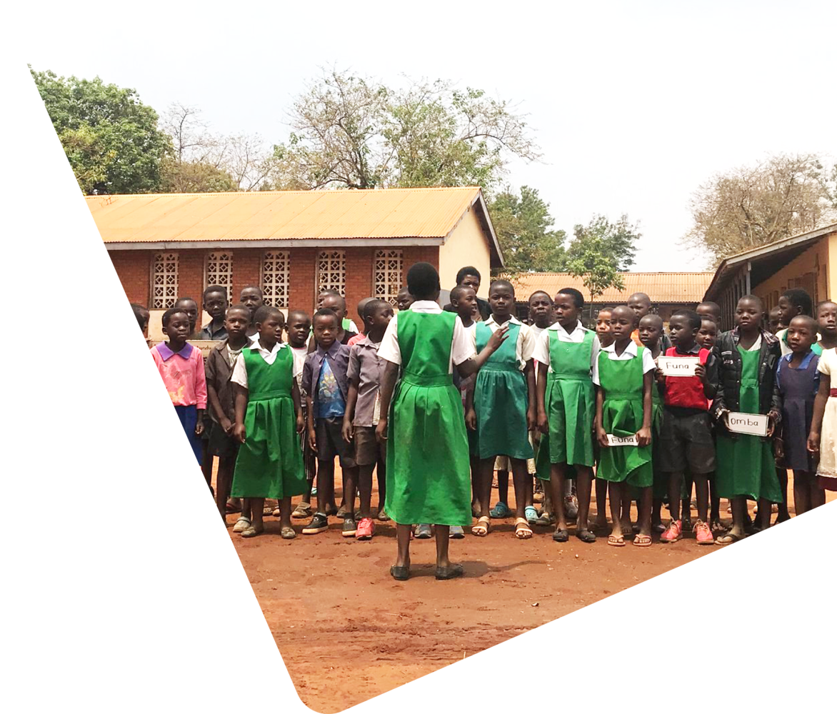 teacher in Malawi in front of students