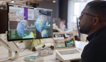 man sitting at a computer