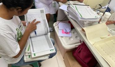 woman looking at data in a spreadsheet