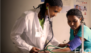 doctor taking patients blood pressure