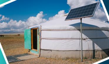 a solar panel next to a modern yurt in Mongolia