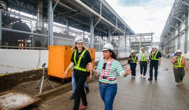 women taking tour of plant as part of Investing in Women event