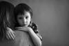 boy on mother's shoulder