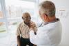 Doctor listening to patient with a stethoscope