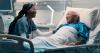 Bed, nurse and smile with patient in hospital for help, support and good news with care