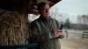 farmer looking at his mobile phone