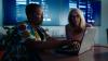 two women looking at a laptop together