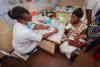 doctor meeting with mother and infant