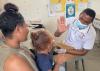 Honeu Bomiringke giving a high five to a nursing officer