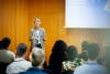 Presentation Being Given By Businesswoman At Conference