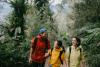 Happy family hiking in forest