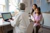 doctor talking to a mother and her daughter