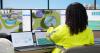 Woman Engineer Uses Computer To Monitor Water Treatment System Quality