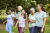 Multiracial female friends are walking together after yoga routine. 