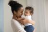 smiling mother holding her child