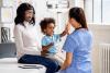 doctor talking to a mother and child