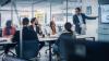Diverse Team of Young Entrepreneurs, Specialists Talk, Use TV Screen for infographics