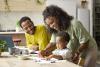 Mother teaching drawing to toddler son at home